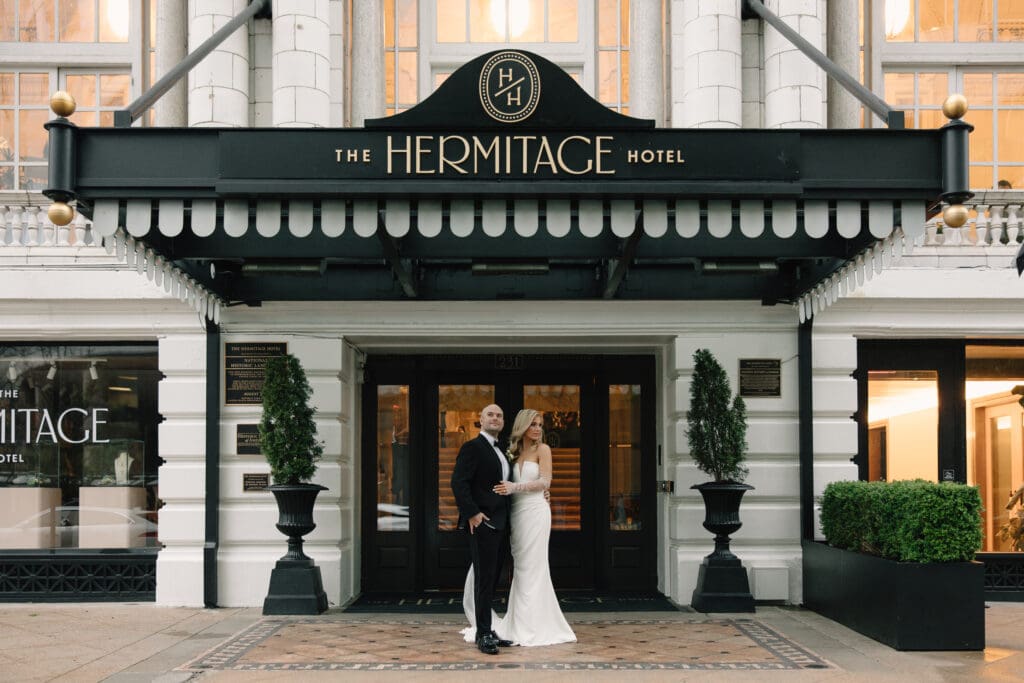 Bride and groom portrait in front of The Hermitage Hotel in Nashville photographed by Ashlyn McKenna